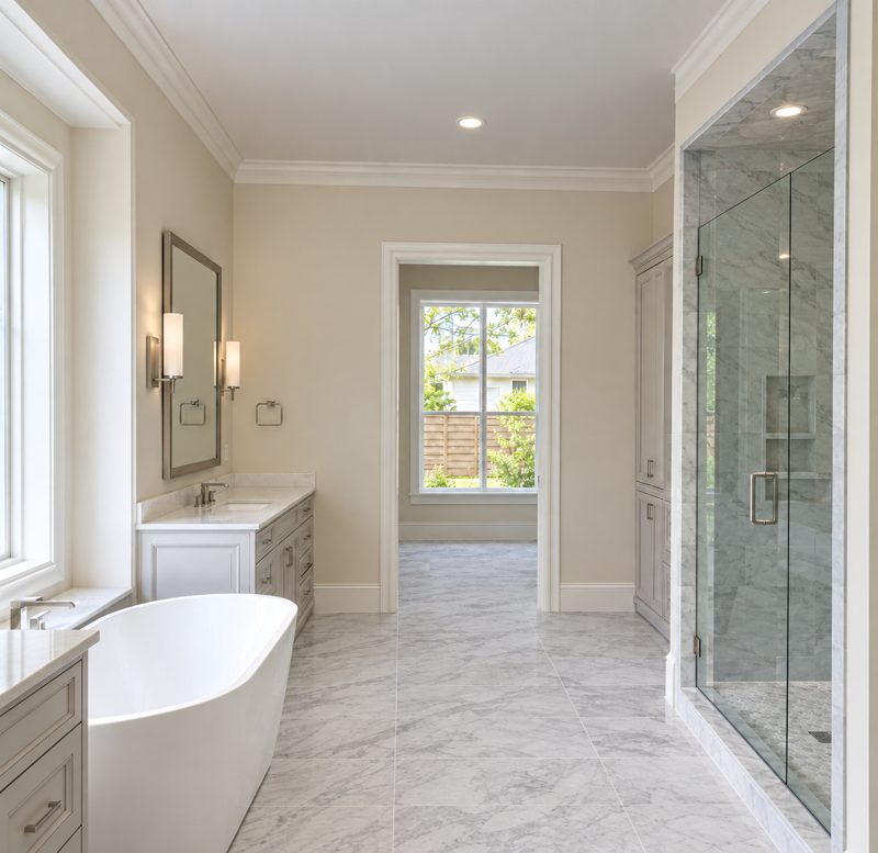 Master bathroom with freestanding tub and glass shower, plumbed by Mountainside Mechanical